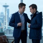 Professional man wearing business casual clothing in rainy downtown Seattle before a job interview