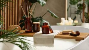 Spa-like bathroom setup with towels, candles, and bath essentials